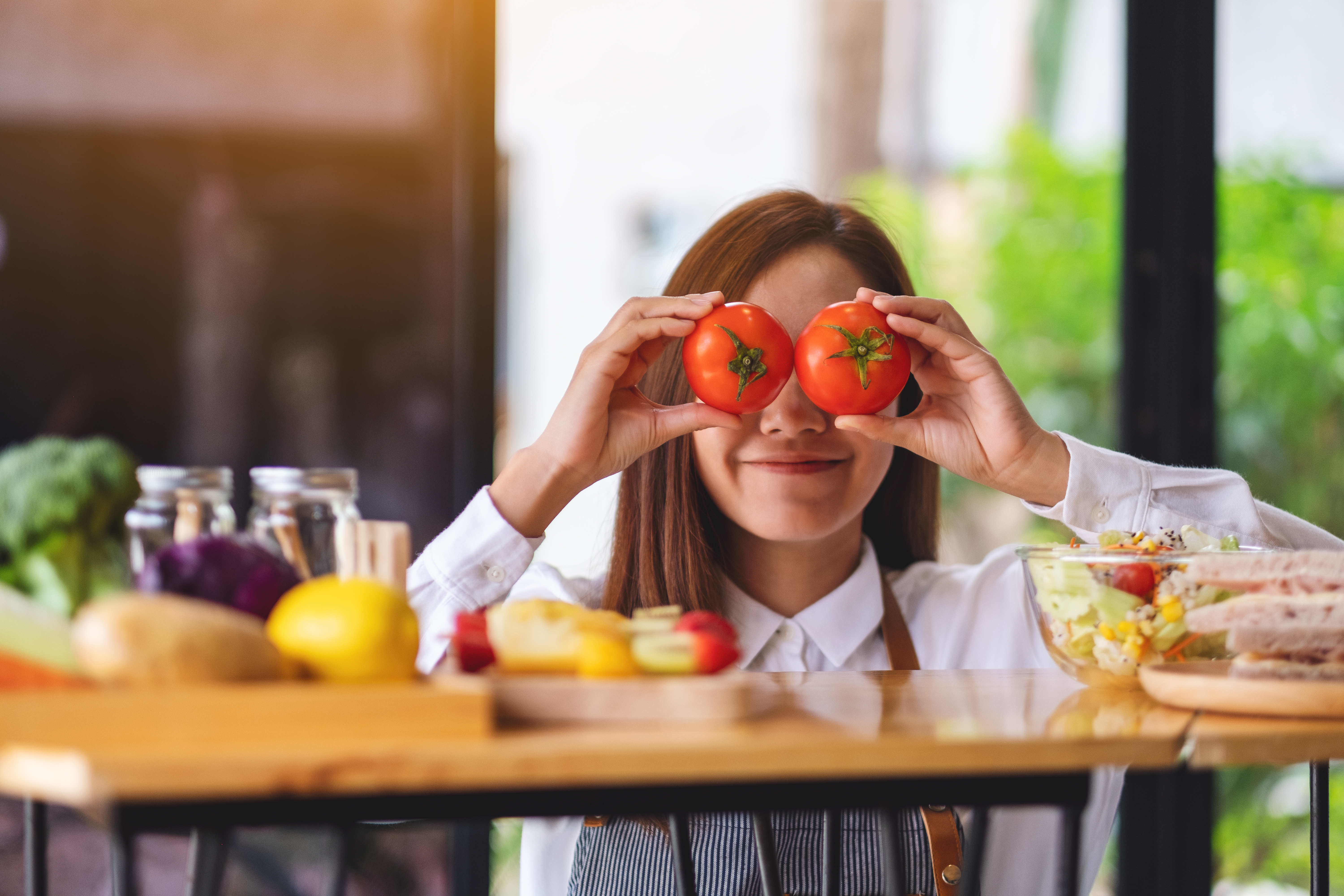 Woman holding foods that are good for eyesight