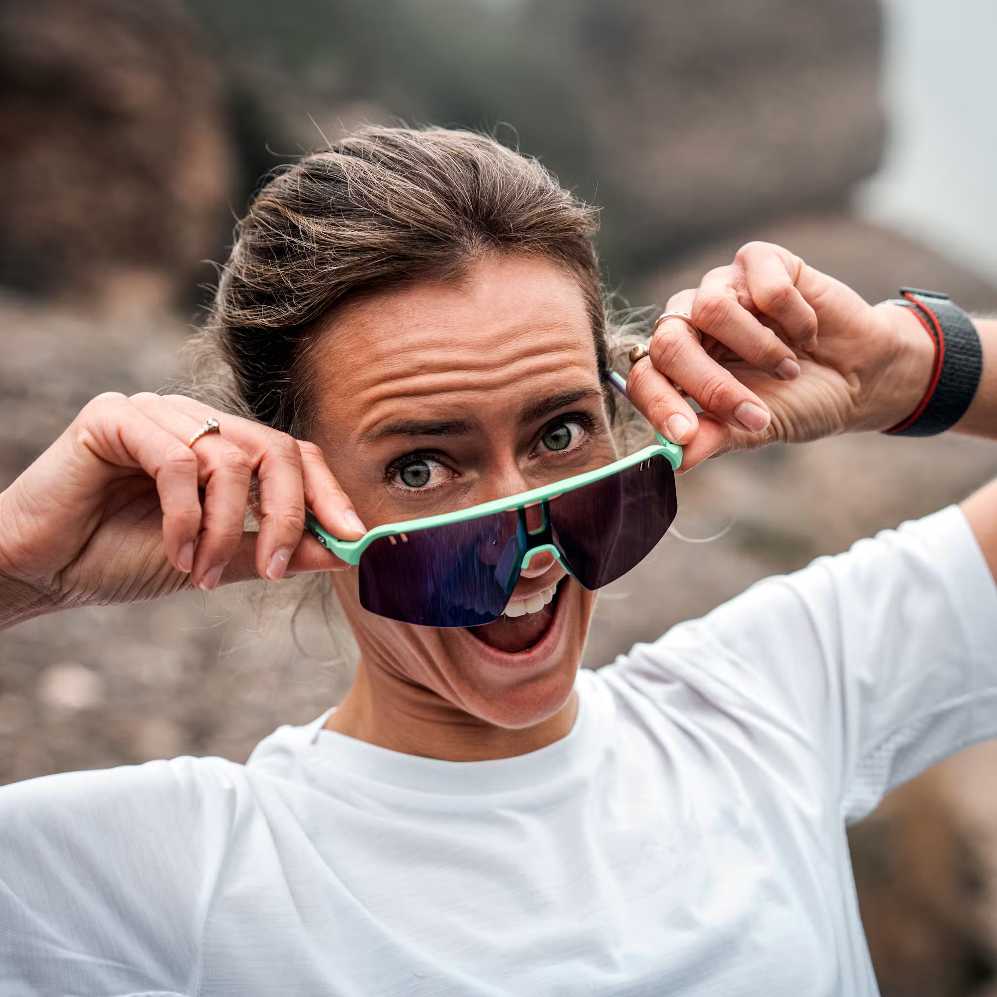 Trail athlete wearing Julbo Reactiv sunglasses under bright sun
